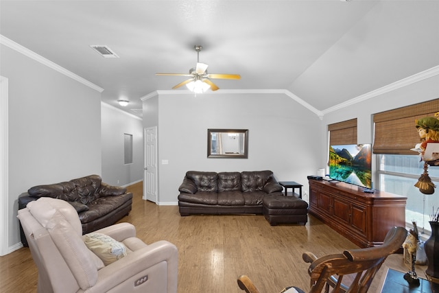 living room with ceiling fan, light hardwood / wood-style flooring, crown molding, and vaulted ceiling