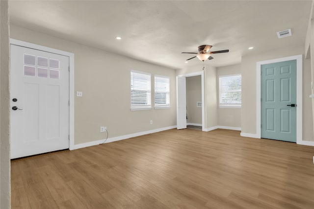 entryway featuring light wood-type flooring and ceiling fan