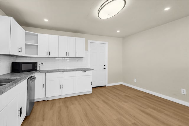 kitchen featuring dishwasher, light hardwood / wood-style flooring, and white cabinetry