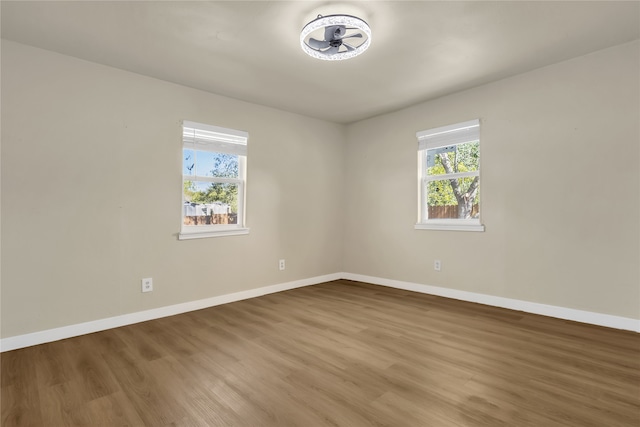 spare room featuring hardwood / wood-style floors