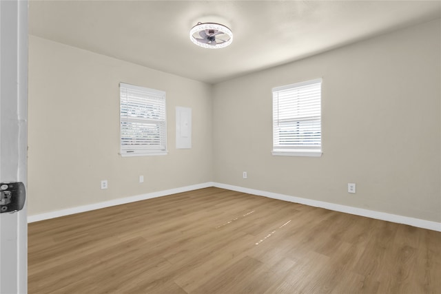 spare room with light hardwood / wood-style floors