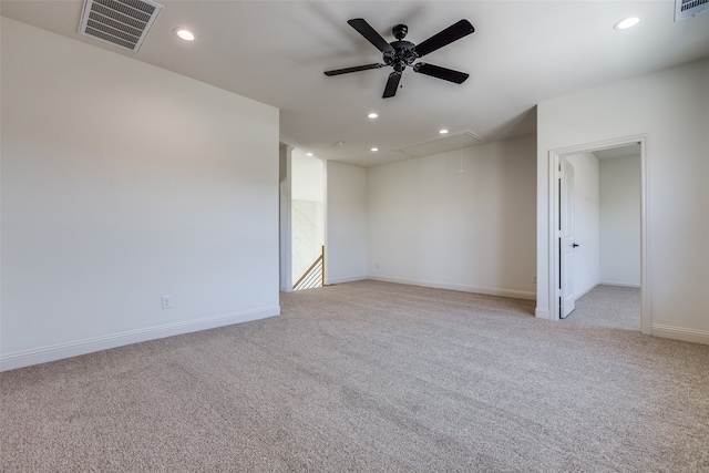 carpeted empty room featuring ceiling fan