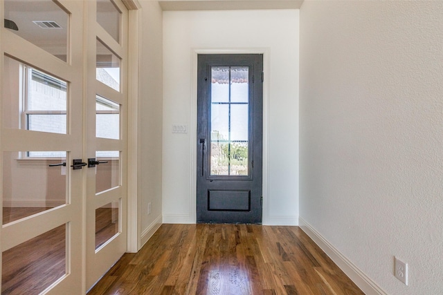 1120 Stonebridge Pass, Gunter, TX 75058 - entryway featuring french doors, dark wood-style flooring, and baseboards