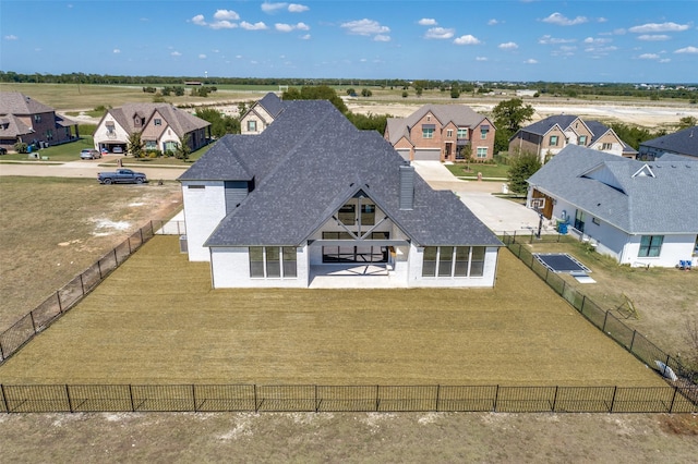 1120 Stonebridge Pass, Gunter, TX 75058 - back of property featuring a residential view and a fenced backyard