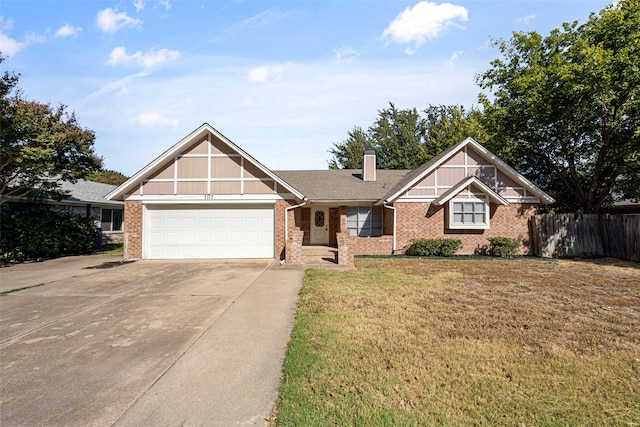 view of front of home featuring a front yard and a garage