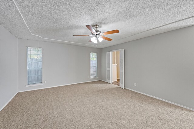 empty room with a healthy amount of sunlight and light colored carpet