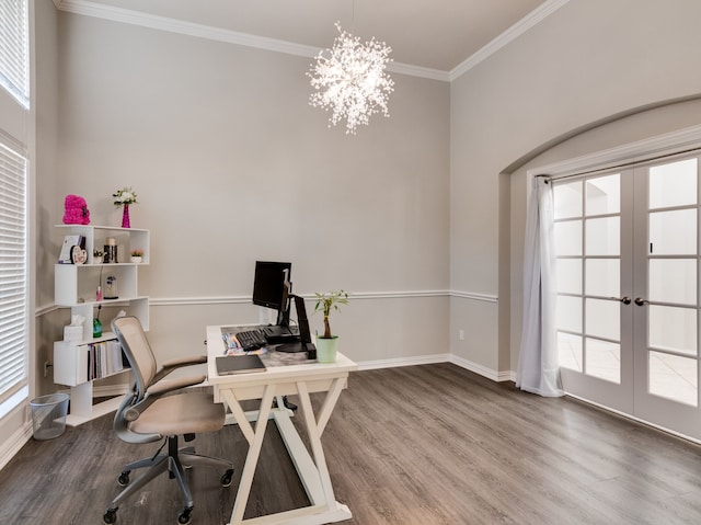 office featuring wood-type flooring, ornamental molding, an inviting chandelier, and french doors