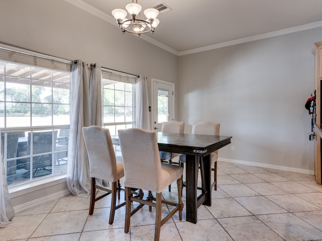 tiled dining room featuring an inviting chandelier and ornamental molding