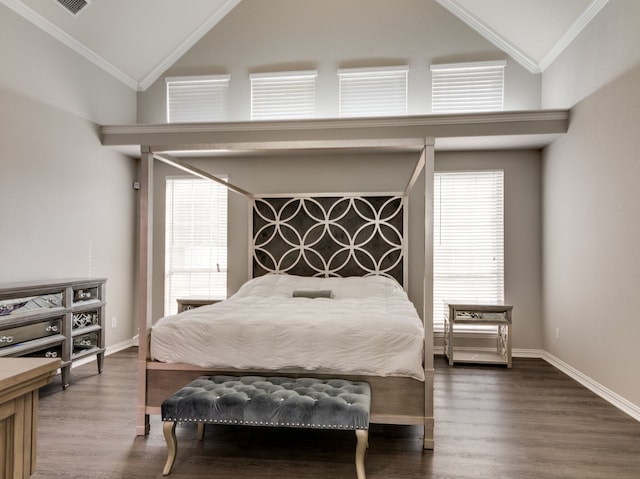 bedroom featuring dark hardwood / wood-style floors, ornamental molding, and multiple windows