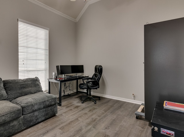 office featuring wood-type flooring, lofted ceiling, and crown molding