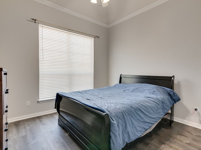 bedroom featuring crown molding, dark hardwood / wood-style floors, and ceiling fan