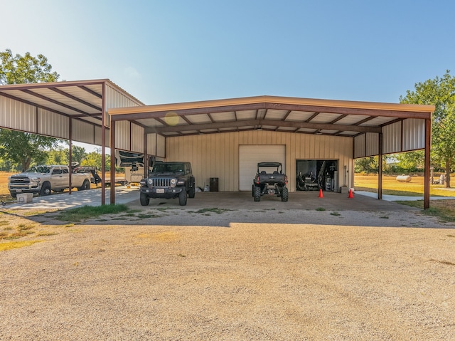 view of parking / parking lot featuring a garage and a carport