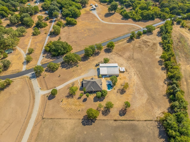 birds eye view of property featuring a rural view