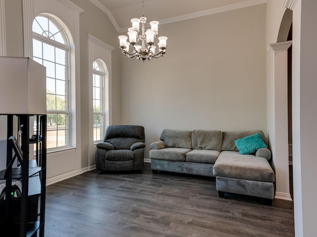 living area with a chandelier, dark wood-style flooring, and crown molding