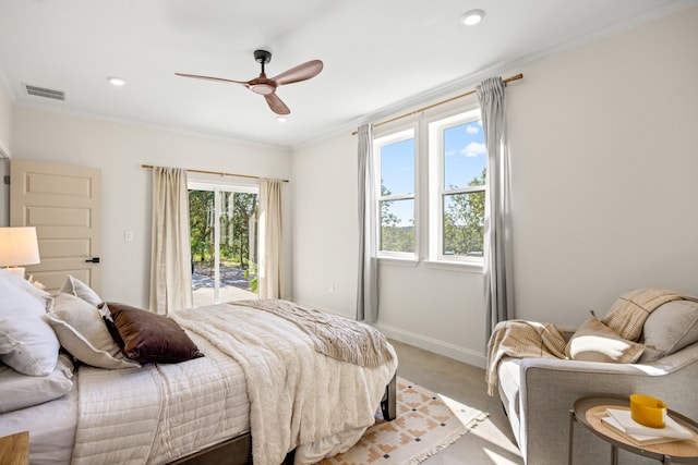 carpeted bedroom featuring access to outside, crown molding, multiple windows, and ceiling fan