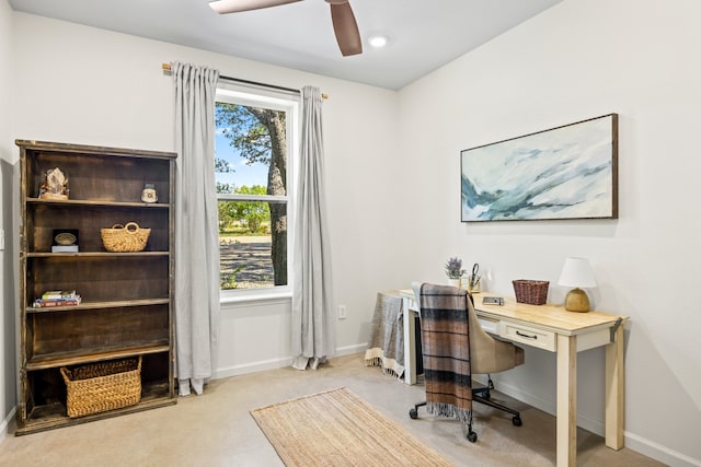 office area with light carpet and ceiling fan