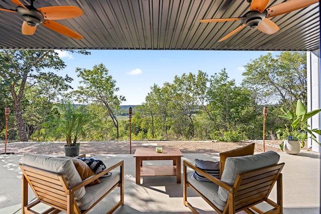 view of patio with an outdoor living space and ceiling fan