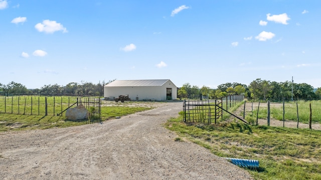 view of home's exterior with a rural view