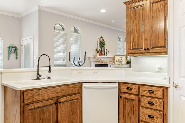 kitchen with white dishwasher, kitchen peninsula, crown molding, and sink