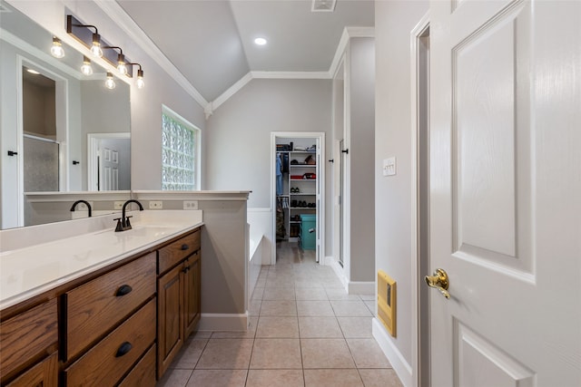 bathroom featuring vaulted ceiling, tile patterned floors, vanity, crown molding, and an enclosed shower