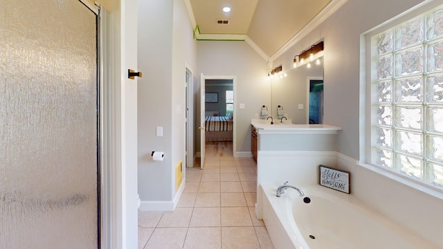 bathroom featuring shower with separate bathtub, a wealth of natural light, tile patterned flooring, and vanity