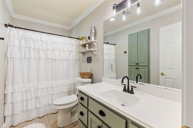 bathroom featuring vanity, crown molding, toilet, and tile patterned floors