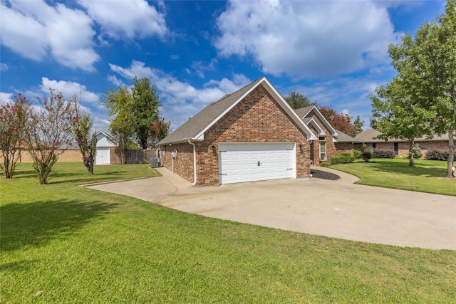 exterior space featuring a front yard, cooling unit, and a garage