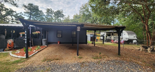 exterior space with a carport