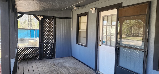 entryway featuring wood-type flooring and vaulted ceiling