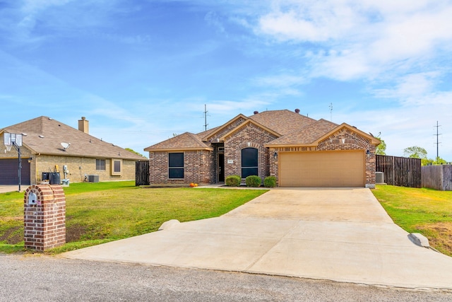 ranch-style home featuring a front yard, a garage, and cooling unit