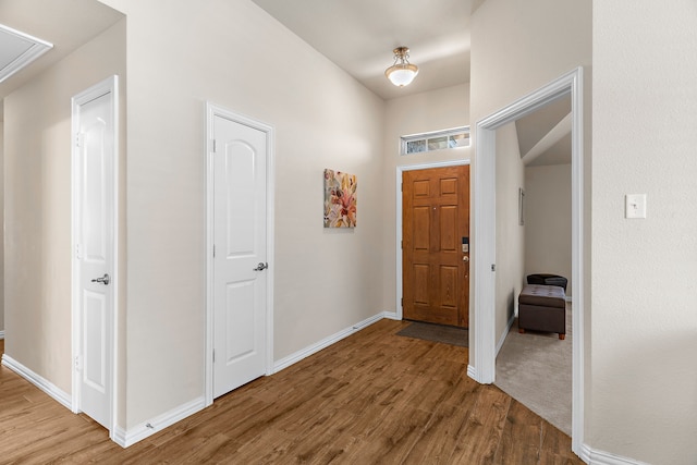 foyer entrance with hardwood / wood-style flooring