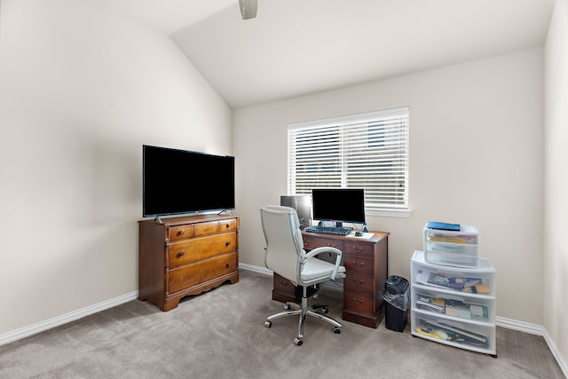 office area featuring vaulted ceiling and light colored carpet