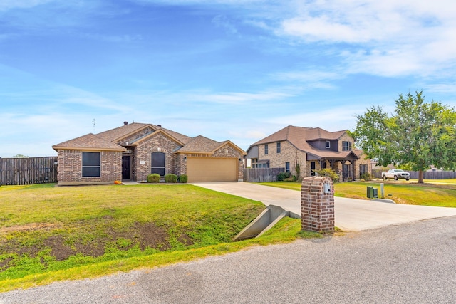 view of front facade featuring a front yard and a garage