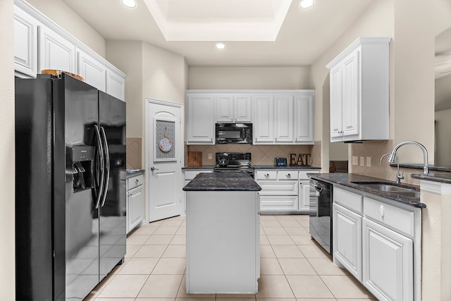 kitchen featuring white cabinets, black appliances, and a kitchen island