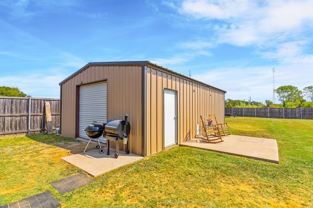 view of outbuilding featuring a yard