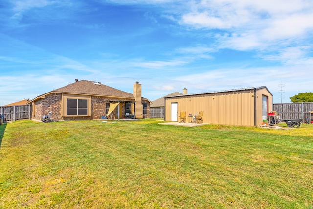 rear view of house with a yard