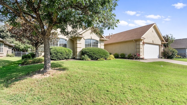 view of front of home with a garage and a front lawn