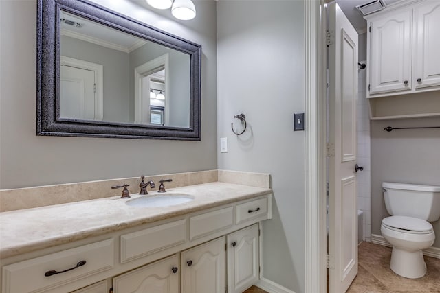 bathroom featuring vanity, tile patterned flooring, ornamental molding, and toilet