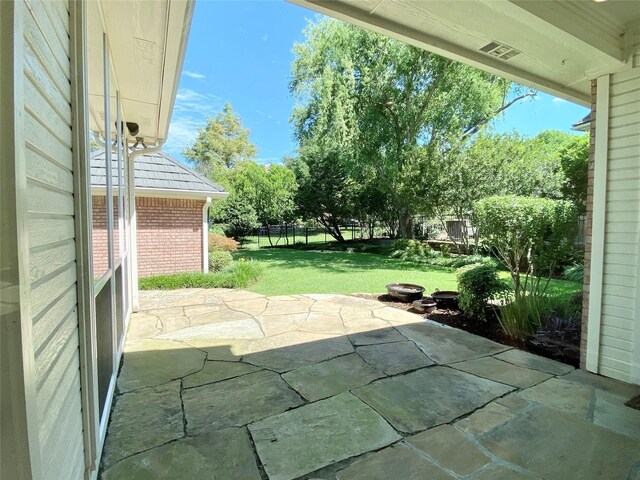 view of front of home with a patio area and a front lawn