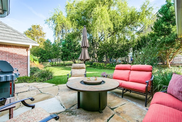 view of patio / terrace with an outdoor living space and a grill