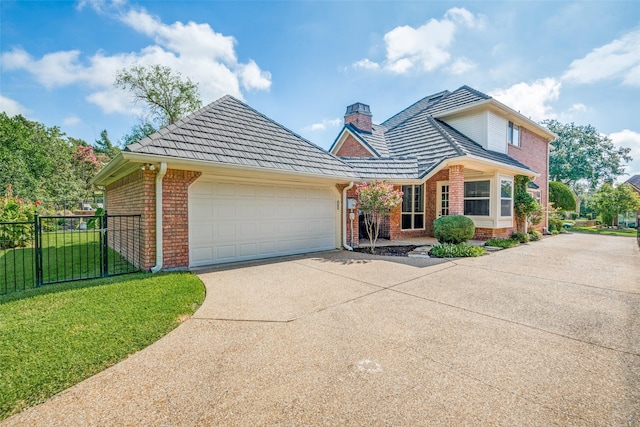 view of front of house featuring a garage and a front yard