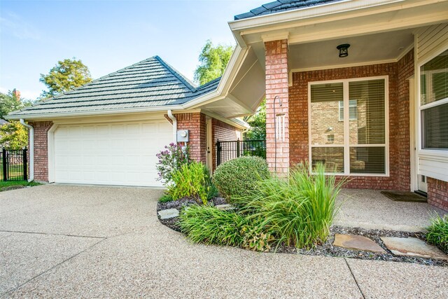 view of front of property with a garage and a front lawn