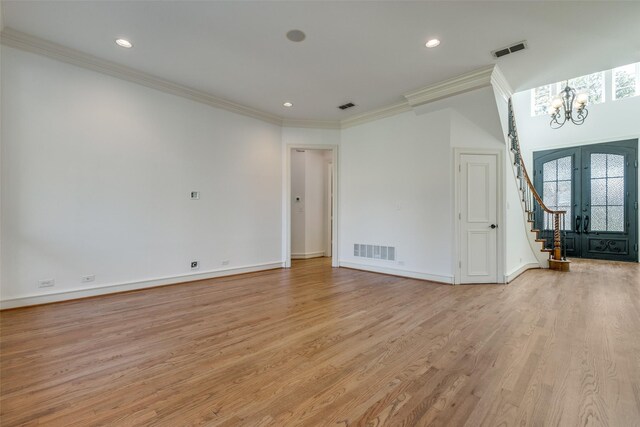 dining space with an inviting chandelier, crown molding, and dark wood-type flooring