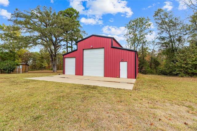 garage featuring a yard