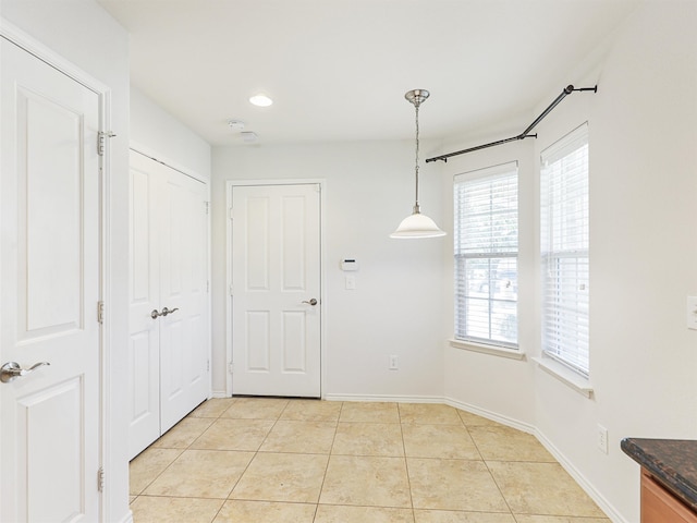 interior space featuring light tile patterned floors