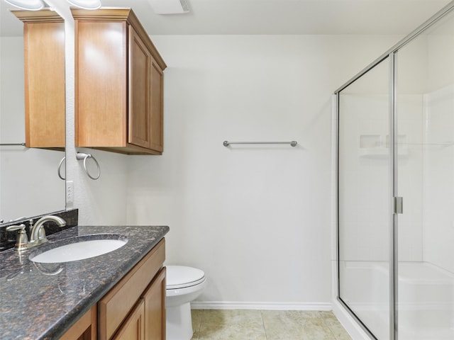 bathroom with toilet, a shower with door, vanity, and tile patterned flooring