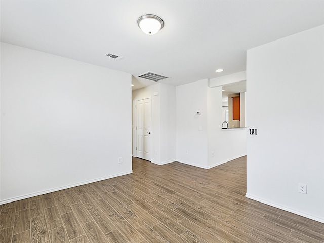 empty room featuring hardwood / wood-style flooring