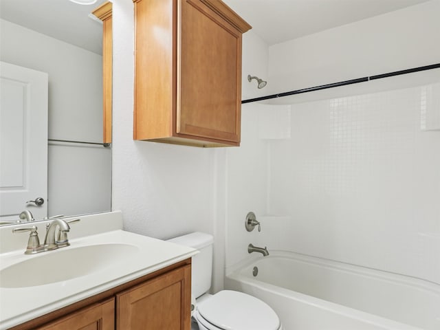 full bathroom with bathtub / shower combination, vanity, and toilet