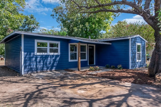 ranch-style home featuring a patio