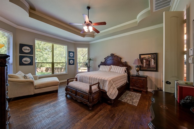 bedroom featuring ceiling fan, dark hardwood / wood-style floors, and multiple windows